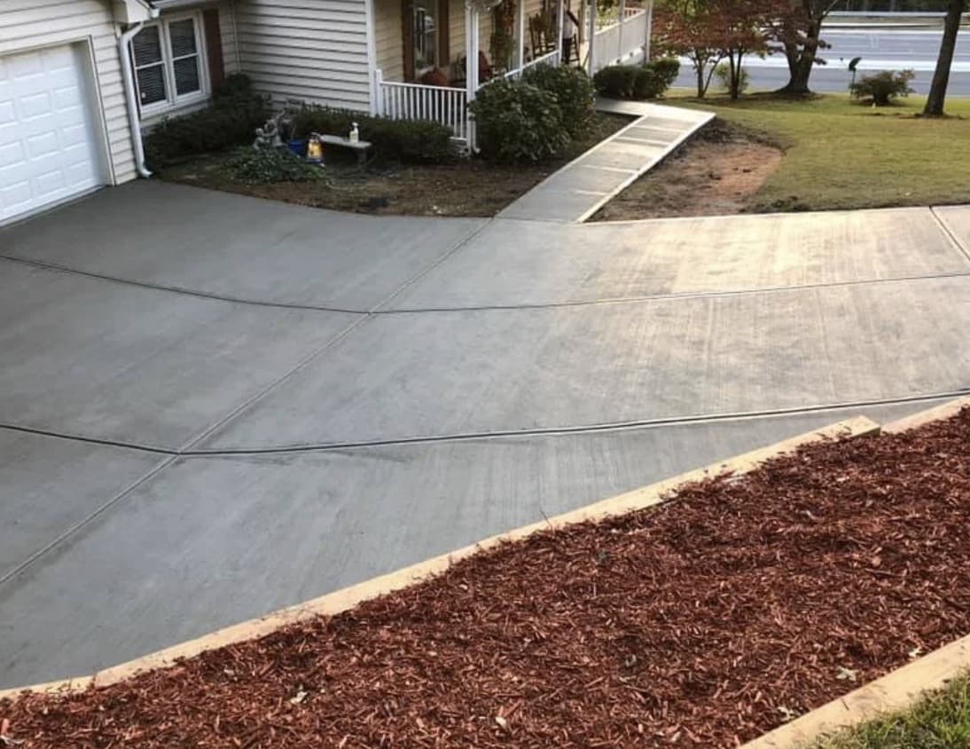 Finished concrete driveway and walkway with control joints in Dallas
